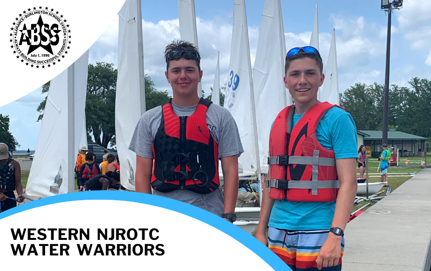Students From left to right are Joseph Versace and Brayden Perfetto at Navy Sailing Academy standing in front of sail boats 