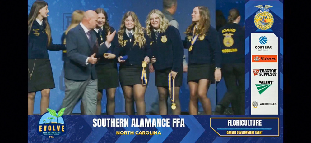 Southern Alamance FFA Floriculture team on stage at the National FFA convention