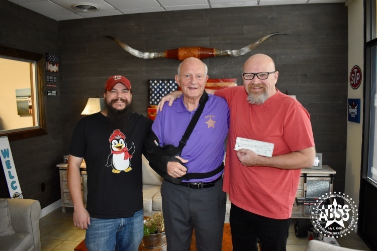 sheriff donates check to Cummings Band pictured with Maverick Radio owner Chuck Marsh and announcer Carson  