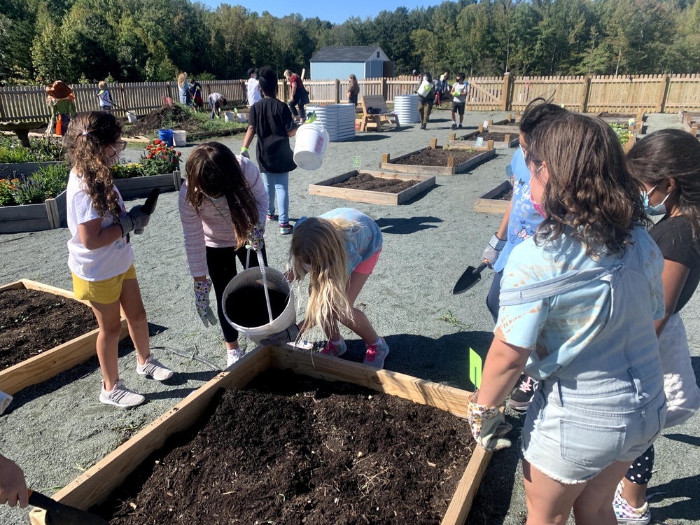 Elon Elementary students working in the community garden
