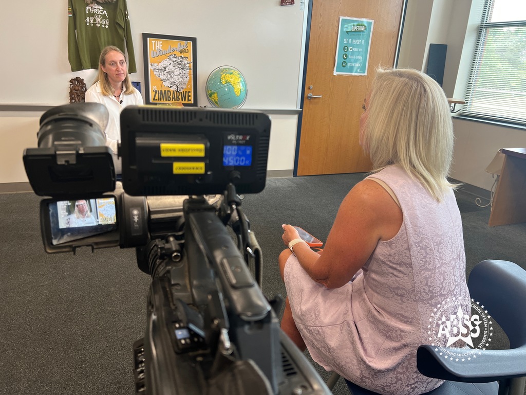 Photo of Cindy Farmer interviewing 2020 Teacher of the Year Kelly Poquette in a classroom