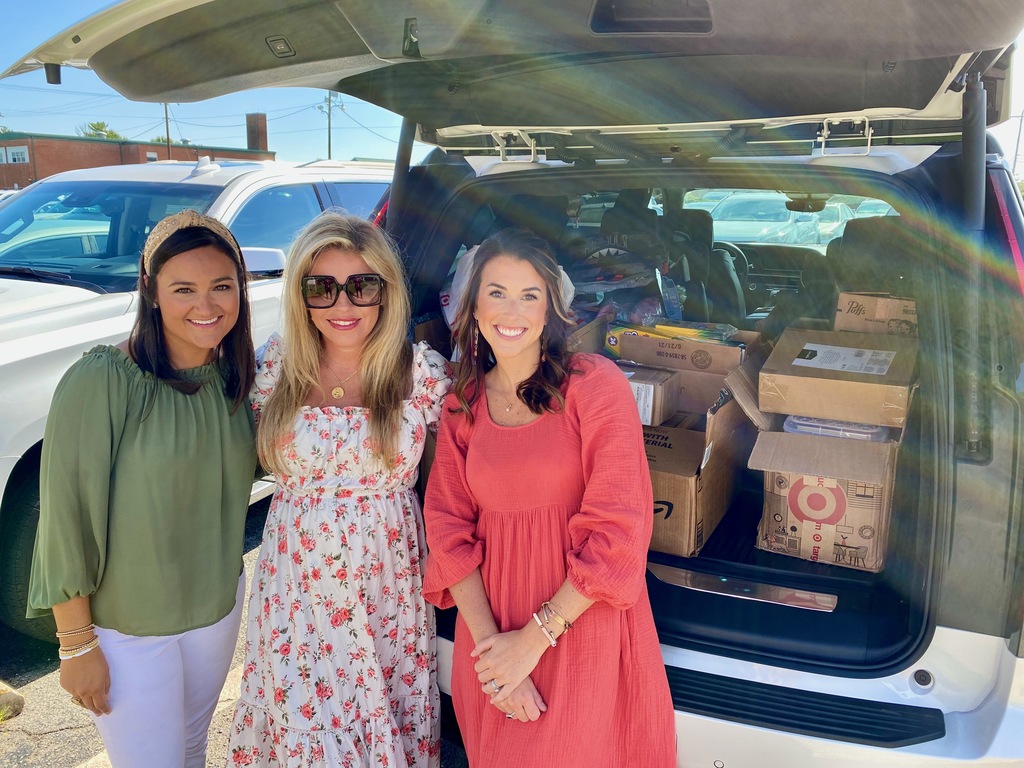 Team from Keller Williams Realty with donated school supplies