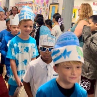 students participating in a global learning parade at Alexander Wilson Elementary  