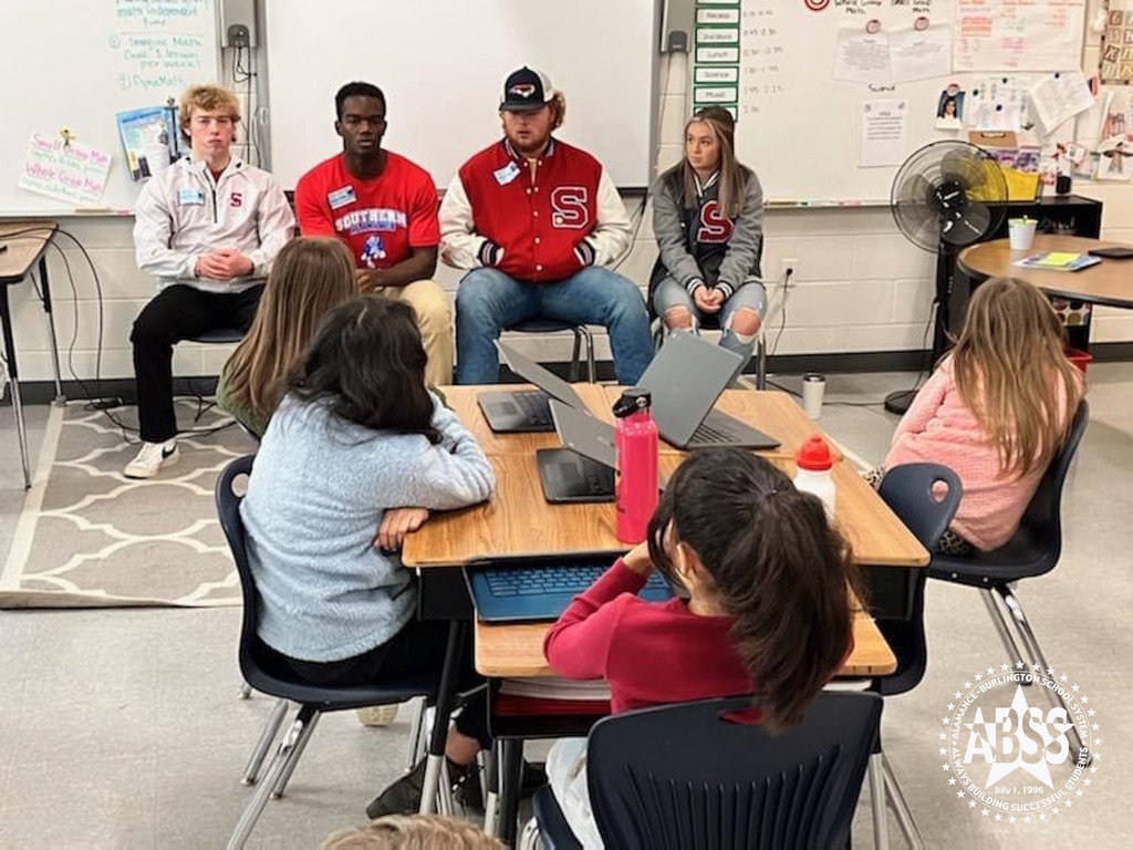 Southern Alamance High School DREAM Team students sitting in front of a fifth grade class at Sylvan Elementary telling inspiration stories of their life