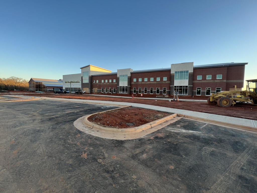 photo of exterior of new high school under construction 