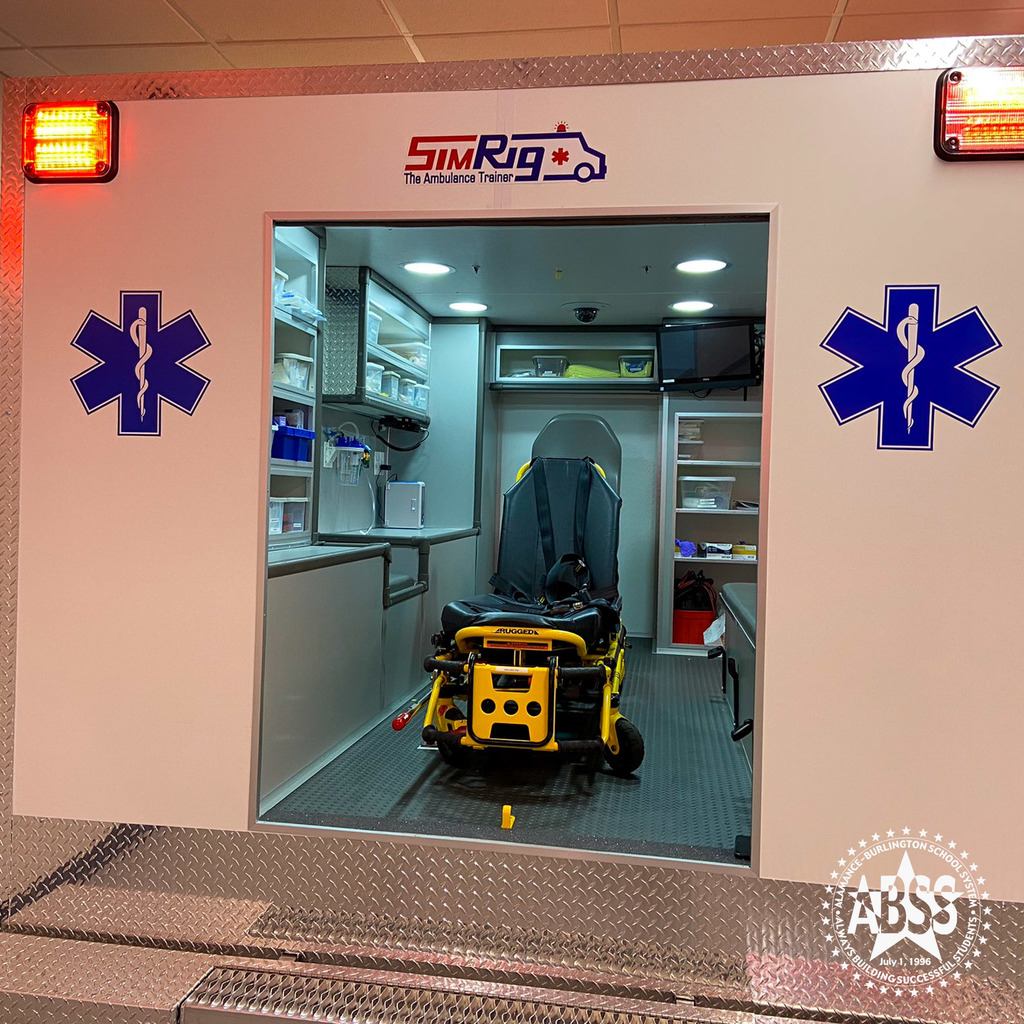 The rear of a simulated EMT ambulance with equipment inside