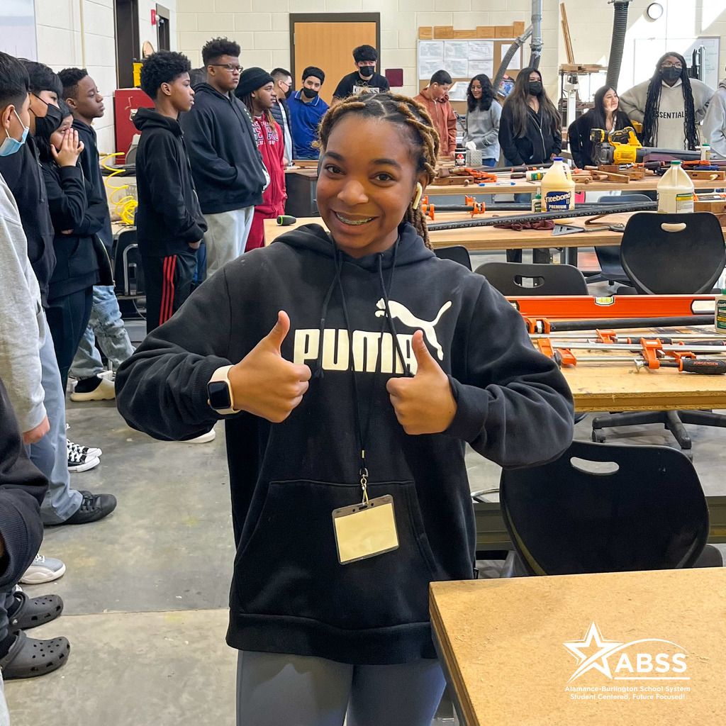 A student from Broadview Middle School gives two thumbs up in a construction classroom at the Career & Technical Education Center