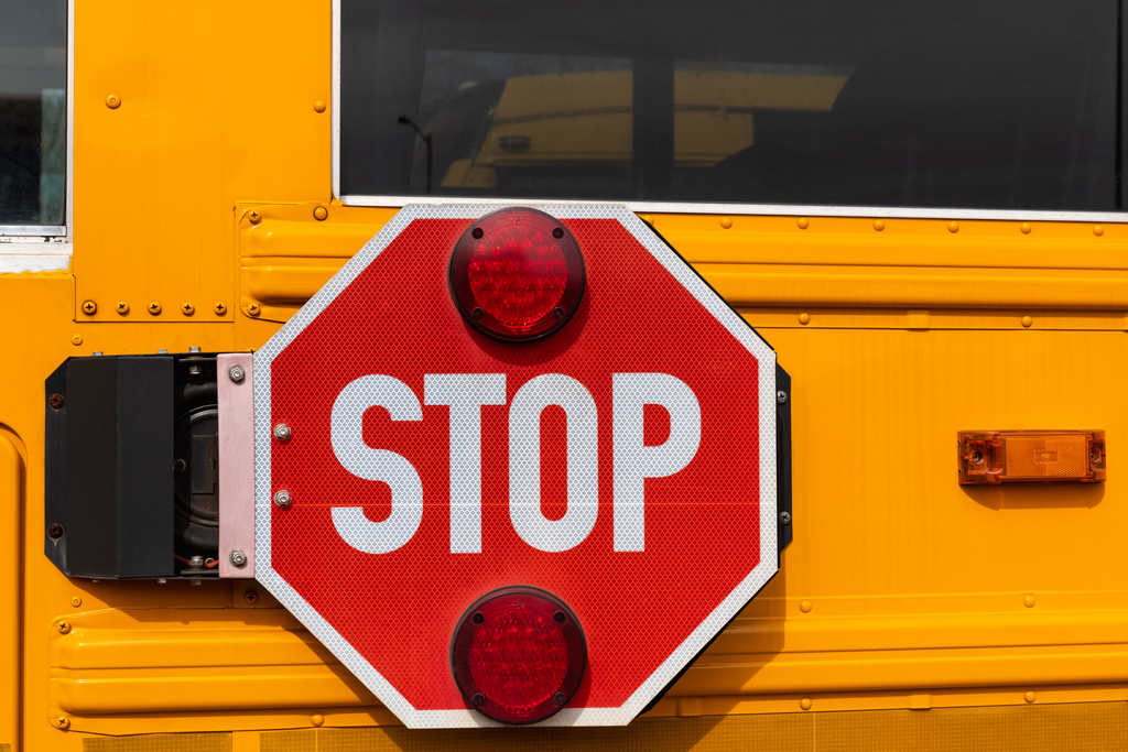 Stock image of stop sign on side of school bus