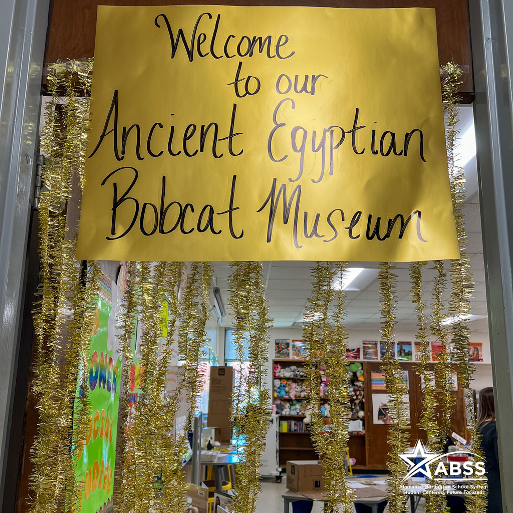 Door display with streamers and gold sign with text Welcome to our Ancient Egyptian Bobcat Museum