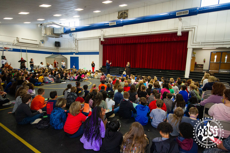 Celebration for Meredith Draughn at BEJ Elementary.  Students in gym seated on the floor while announcement is being made