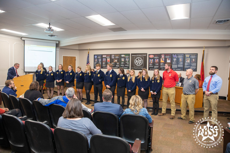 Southern Alamance FFA members in front of board being recognized 