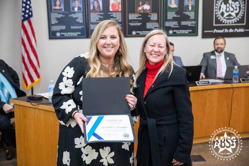 Meredith Draughn holding certificate from Board of Education with her Principal Terri Drumond 