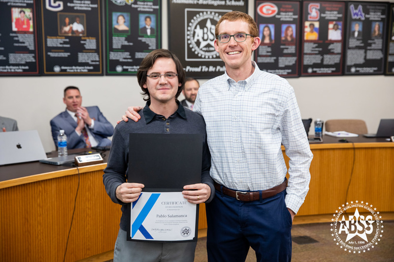 Pablo holding certificate and posing with Eastlawn Principal Dan McInnis