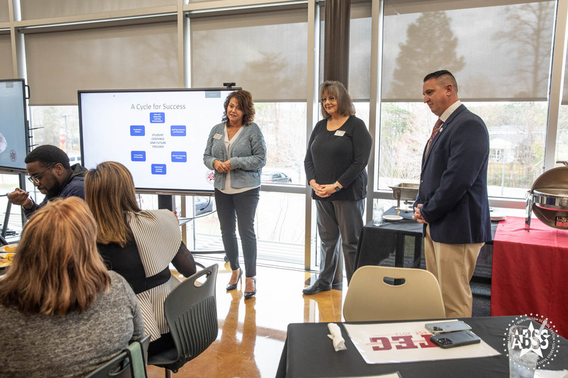 Board of Education members speaking before Leadership Alamance group at CTEC during luncheon 