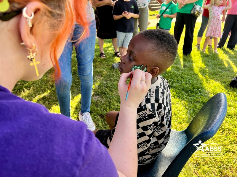 child getting face painted 